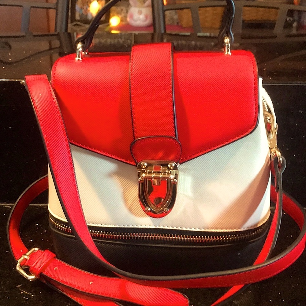 Adorable cream red and black purse in brand new condition smoke free home